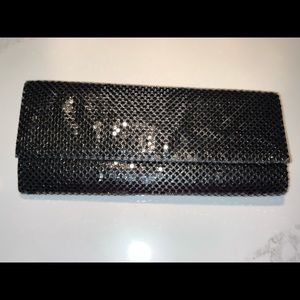 Black mesh envelope purse.Long metal strap can be hidden inside bag or as strap.